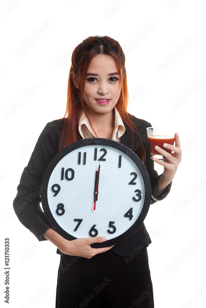 Young Asian business woman with tomato juice and clock. Young Asian business woman with tomato juice and clock.