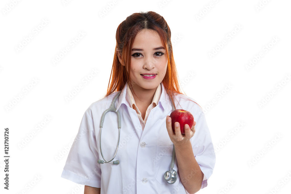 Young Asian female doctor show apple. Young Asian female doctor show apple.