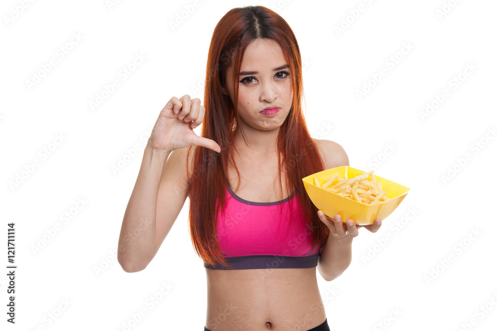 Asian healthy girl thumbs down with french fries. Asian healthy girl thumbs down with french fries.