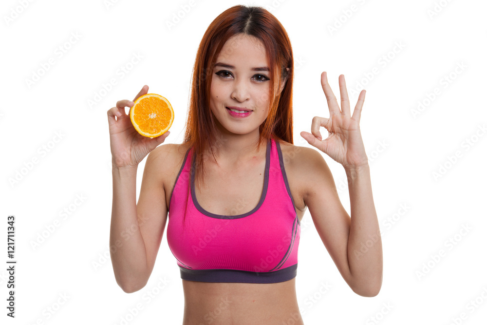 Beautiful Asian healthy girl show OK with orange fruit. Beautiful Asian healthy girl show OK with orange fruit.