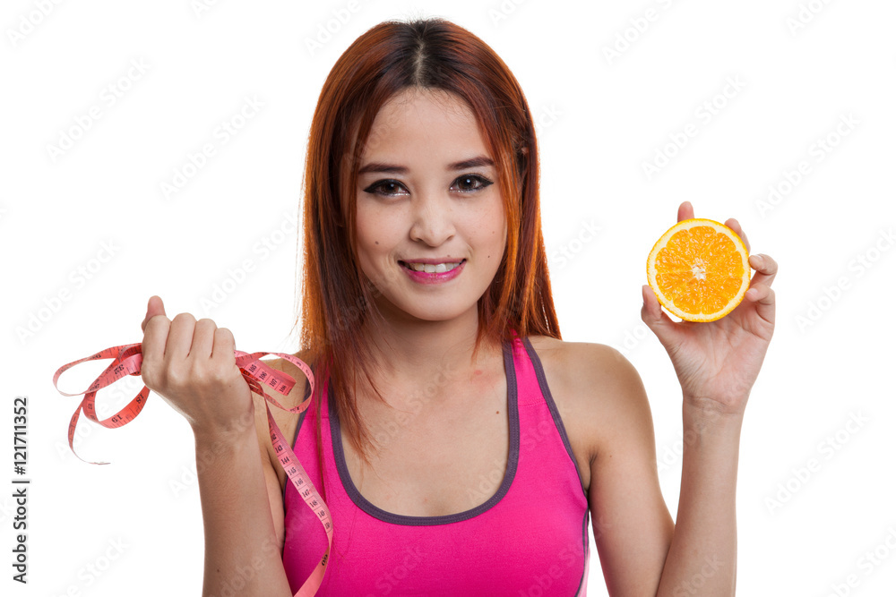 Asian healthy girl on diet with orange fruit and measuring tape. Asian healthy girl on diet with orange fruit and measuring tape.