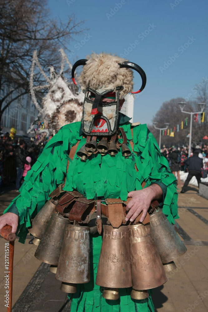 Obraz premium PERNIK, BULGARIA - JANUARY 30, 2016 - Masquerade festival Surva in Pernik, Bulgaria. People with mask called Kukeri dance and perform to scare the evil spirits