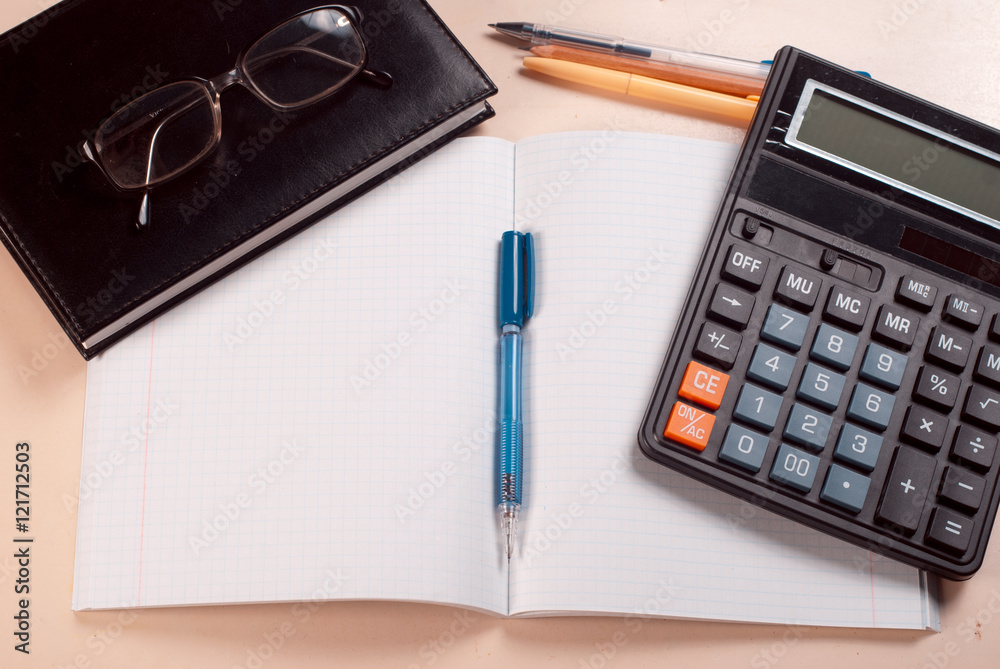 Business concept, Notepad, pencil and calculator on the table Business concept, Notepad, pencil and calculator on the table