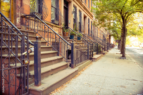 traditional brownstone lined home at harlem, new york © jon_chica