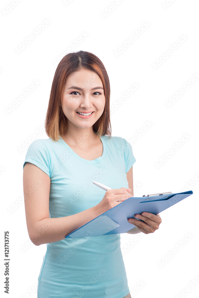 Portrait of young happy smiling asian woman writting on blue fol Portrait of young happy smiling asian woman writting on blue fol