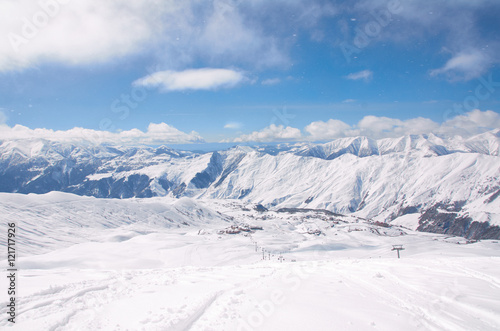 Bird view on the ski village in valley. Background of snowboard resort from the high peak. Winter season for advertising or billboard © Anatoliy Karlyuk