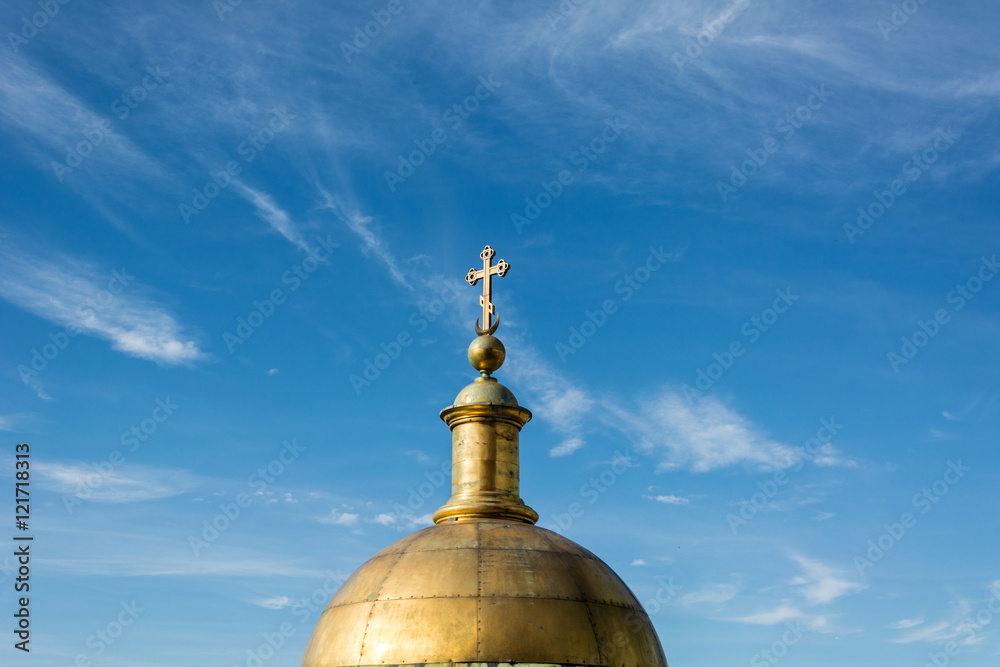 golden dome of the Christian cathedral on a background of the be