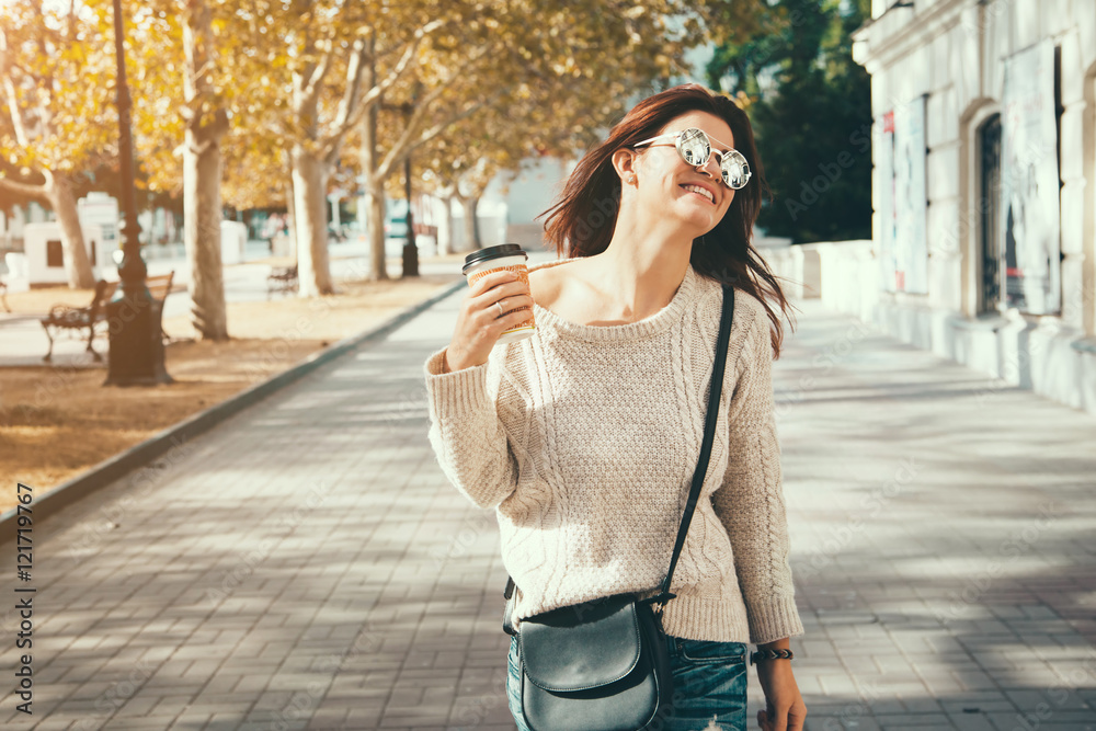 Fototapeta premium Woman walking with take away coffee
