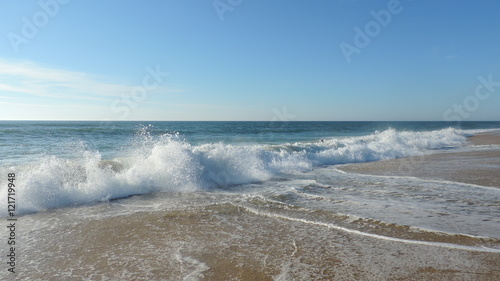 wave blue ocean and beach sand