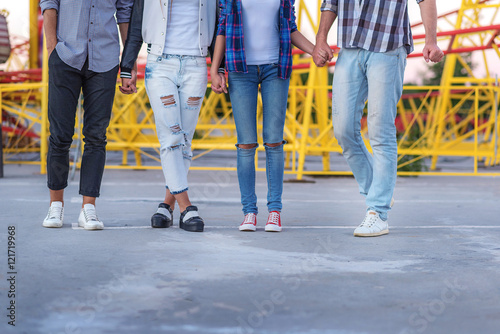 legs of four people on pavement