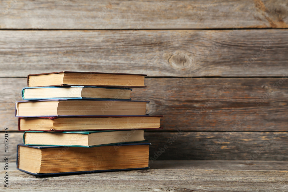 Old antique books on grey wooden table Old antique books on grey wooden table