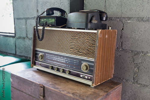 Vintage radio receiver device on old wooden box