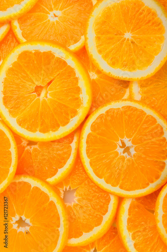 citrus background. juicy slices of orange cover the entire surface