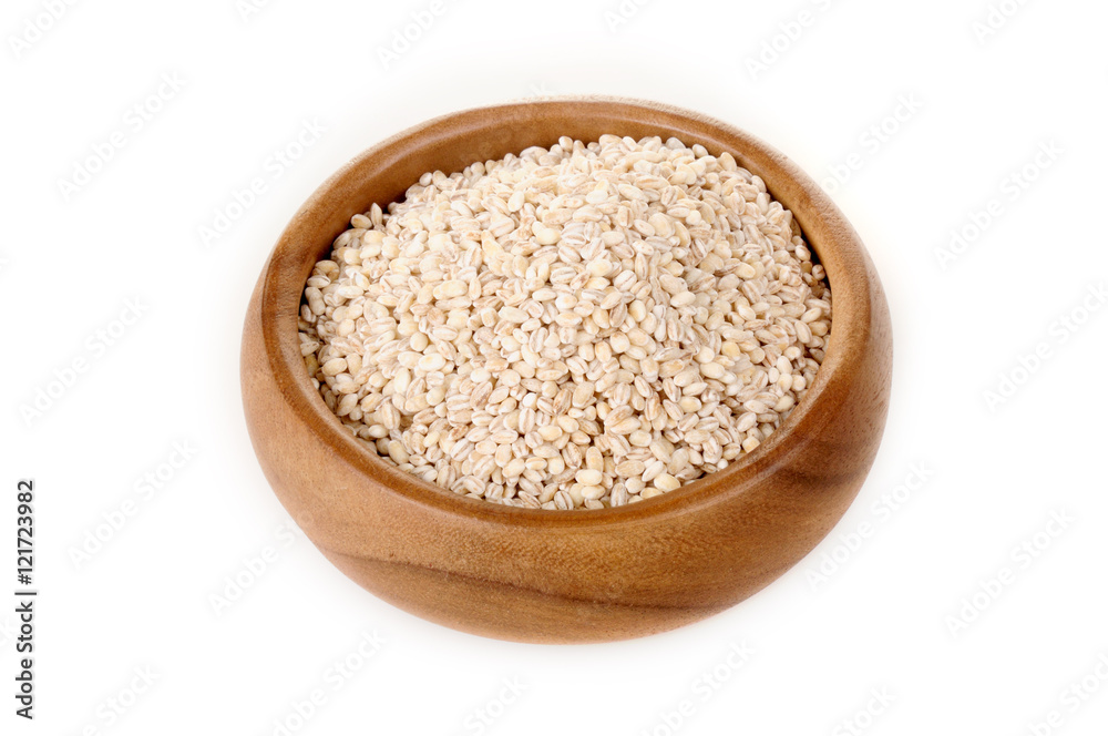 pearl barley in a wooden bowl. for healthy cooking ingredient pearl barley in a wooden bowl. for healthy cooking ingredient