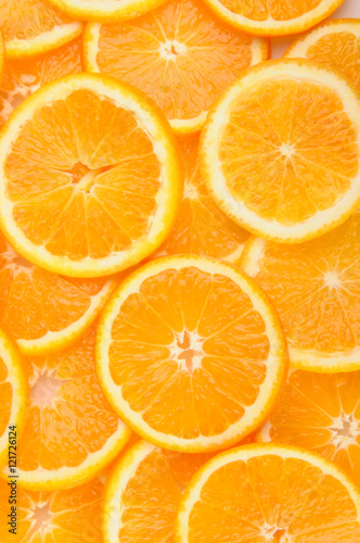 citrus background. juicy slices of orange cover the entire surface.