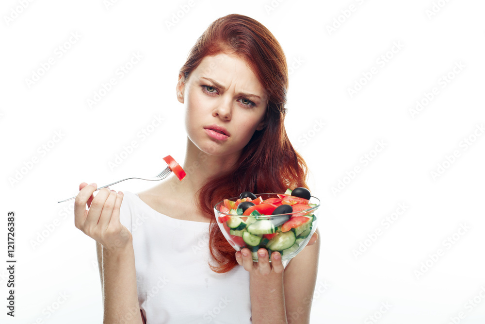 Beautiful woman eating a salad. Isolated background
Beautiful woman eating a salad. Isolated background