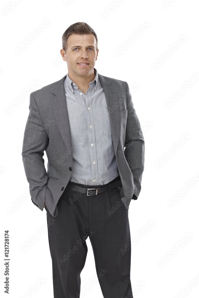 Businessman standing with hands in pockets Businessman standing with hands in pockets