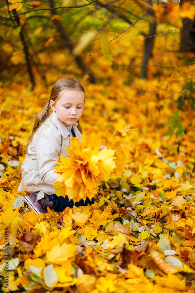 Little girl outdoors at autumn day Little girl outdoors at autumn day