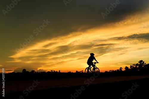 silhouette of girl riding bicycle for health