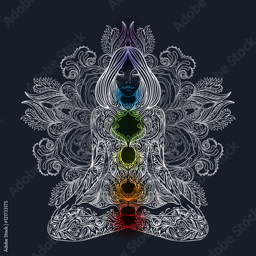 Woman ornate silhouette sitting in lotus pose. Meditation, aura