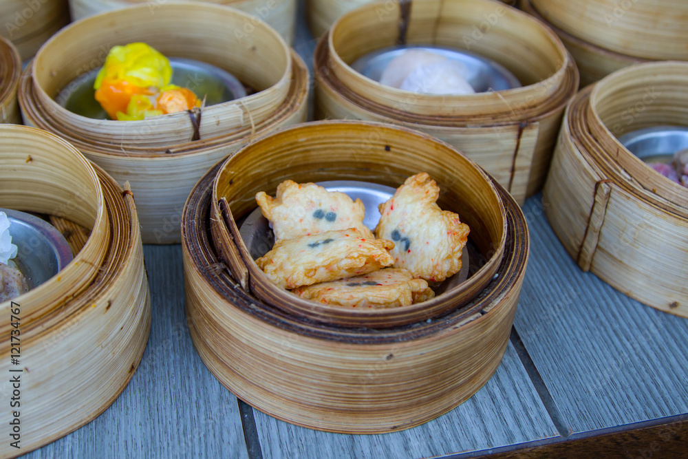 various dim sum in bamboo steamer in chinese restaurant various dim sum in bamboo steamer in chinese restaurant