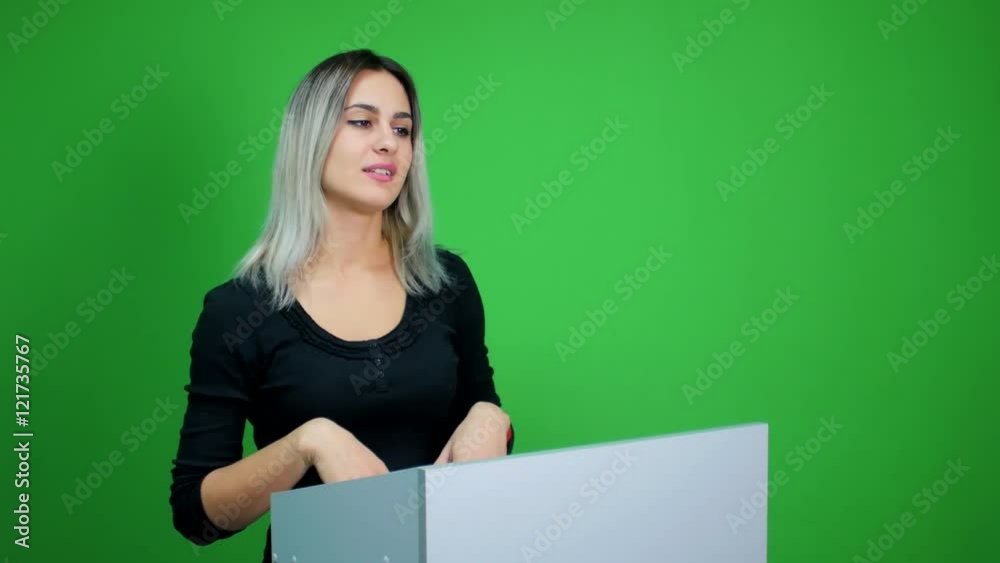 Businesswoman making a presentation at green screen background Businesswoman making a presentation at green screen background