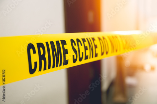 crime scene tape in front room door with flare