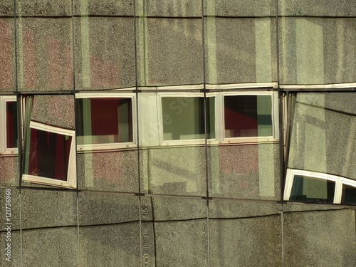 Verspiegelte Glasfassade mit Spiegelung einer Betonfassade mit Fenstern auf dem Messegelände der Köln Messe im Stadtteil Deutz in Köln am Rhein in Nordrhein-Westfalen photo