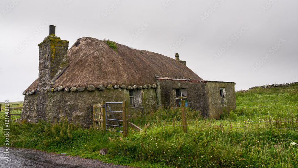 Blackhouse with thatched roof of the 19th century in Scotland. Blackhouse with thatched roof of the 19th century in Scotland.