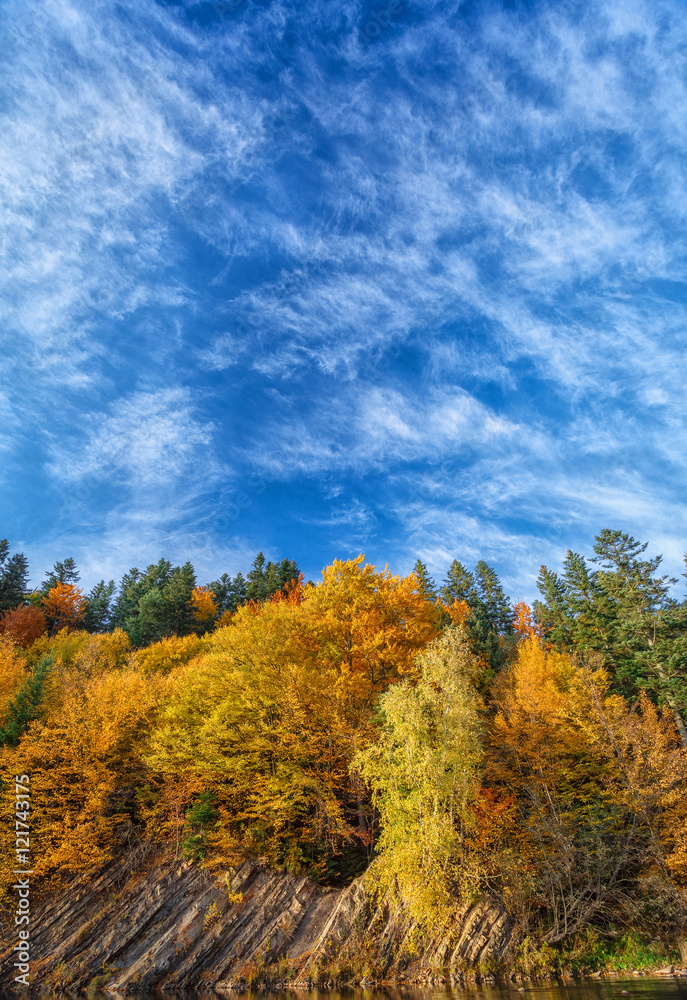 beautiful mountain and rocky shore in autumn forest