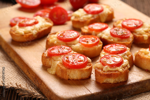 Grilled toast with cheese and tomatoes