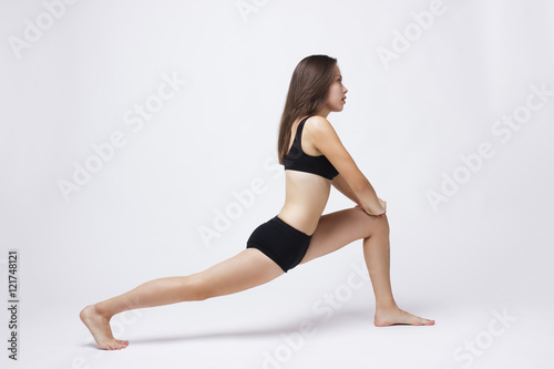 Girl doing workout on a white background