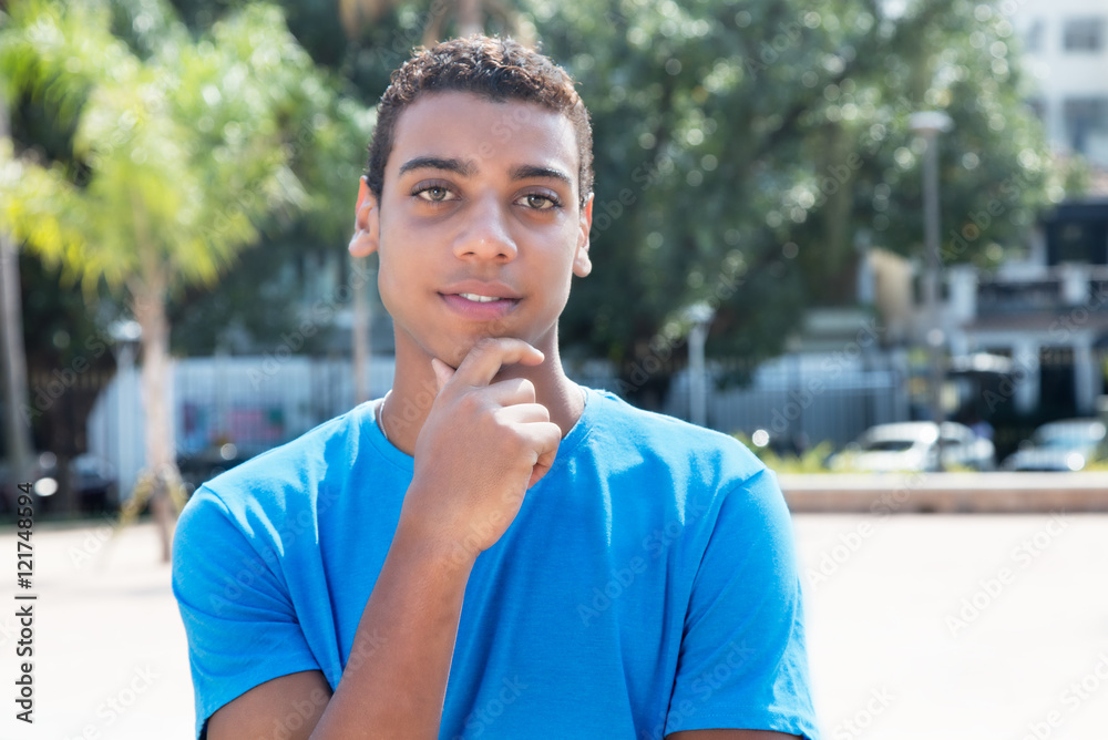 Shy latin american guy with blue shirt Shy latin american guy with blue shirt