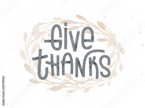 Give Thanks, thanksgiving lettering with a golden wreath under it. Typographic greeting card on white background