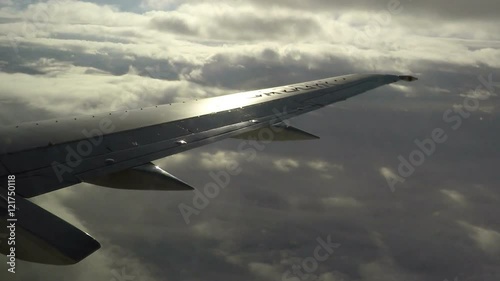 Wallpaper Mural Reflection of sunshine and cloudscape on the wings of an aircraft. Torontodigital.ca