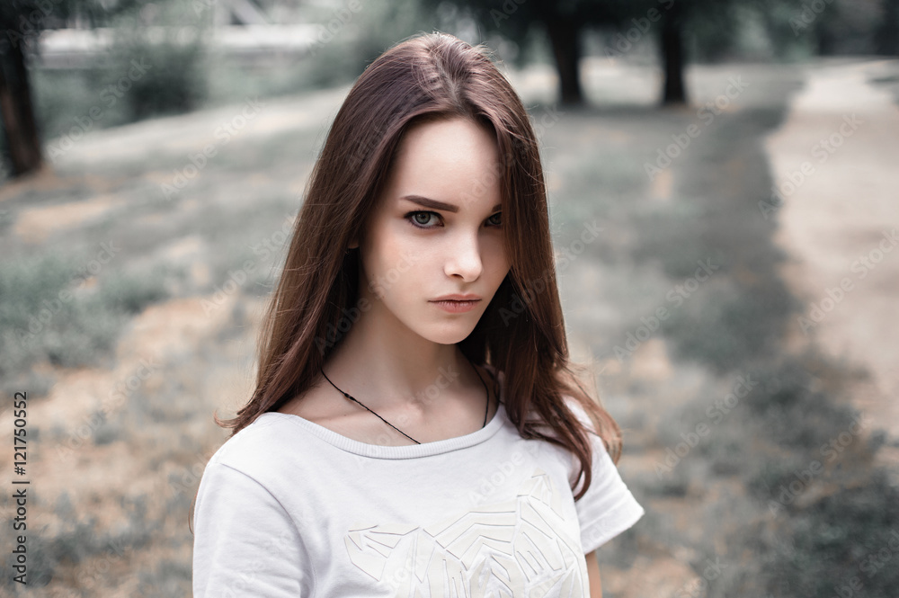 Fototapeta premium portrait of a beautiful girl closeup on street