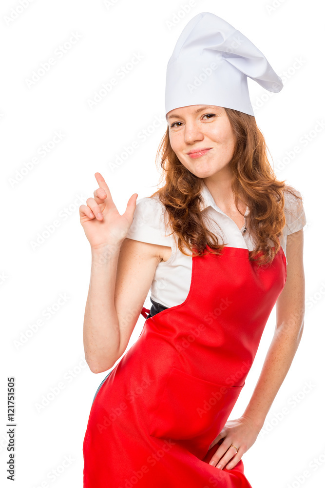 Vertical portrait of a beautiful girl in an apron and chef cap Vertical portrait of a beautiful girl in an apron and chef cap