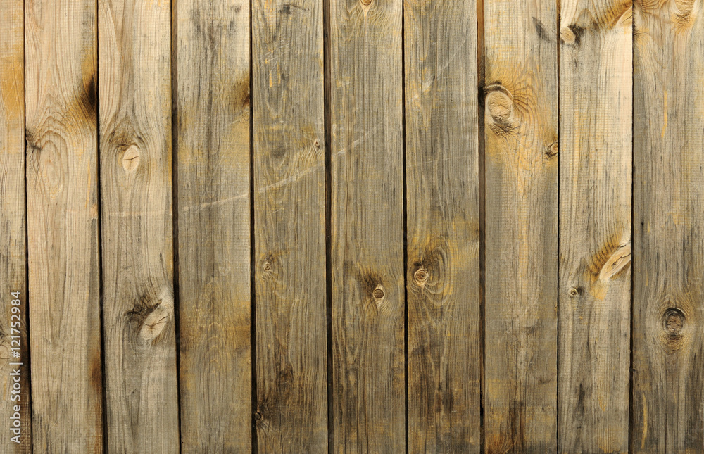 Background from old boards with knots and scratches. traces of the influence of weather. partially tinted photo. Background from old boards with knots and scratches. traces of the influence of weather. partially tinted photo.