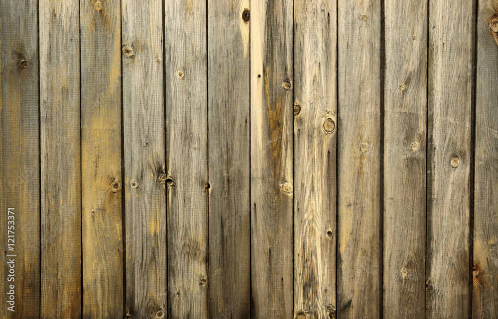 Background from old boards with knots and scratches. traces of the influence of weather. partially tinted photo. Background from old boards with knots and scratches. traces of the influence of weather. partially tinted photo.