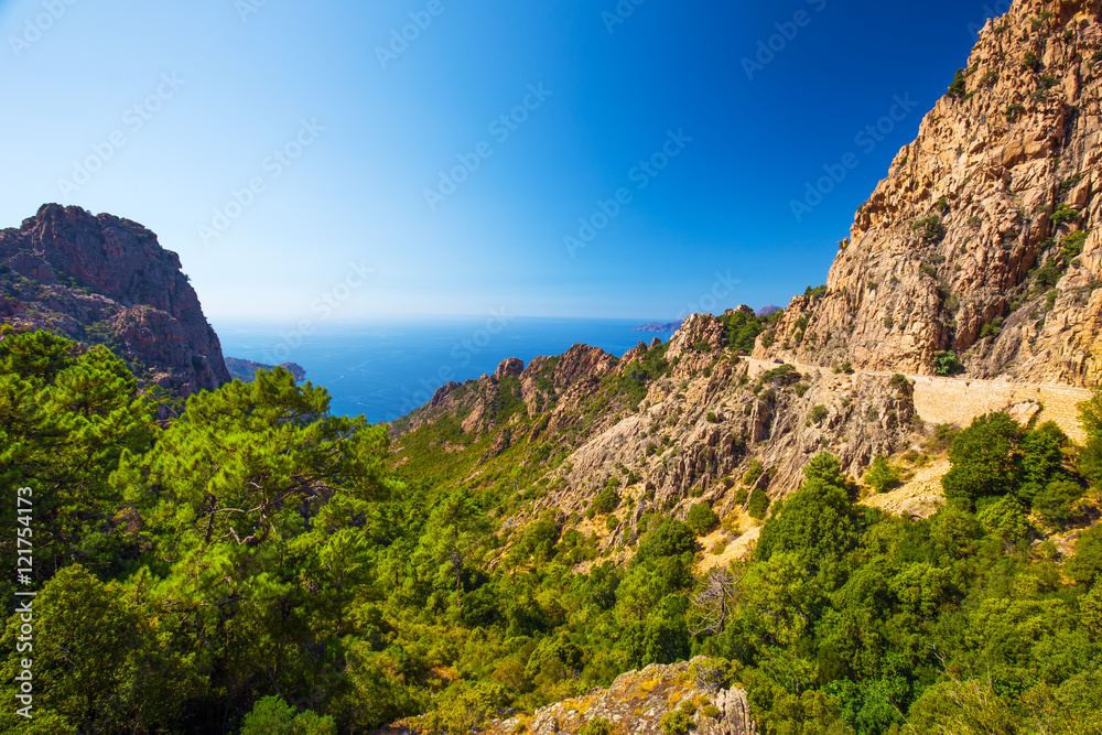 Calanques de Piana with the D81 coastline road on the west coast of Corsica, France