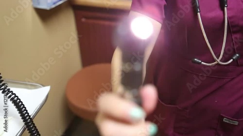 Nurse Performing Eye Exam from Patient's Point of View