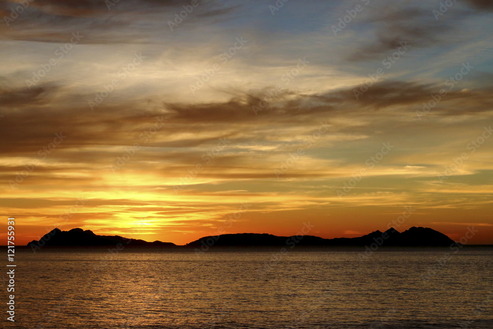 cloudy orange sunset in the beach the sun in Cies Island