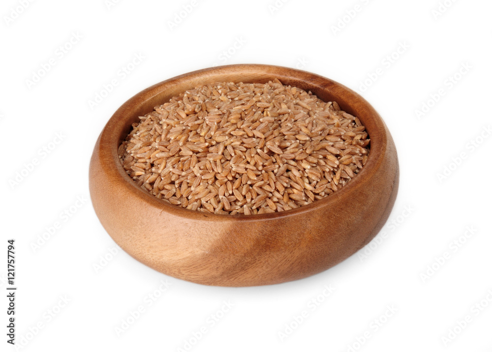 cereal spelled in wooden bowl on a white background. ingredient for a healthy lifestyle. cereal spelled in wooden bowl on a white background. ingredient for a healthy lifestyle.