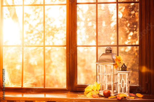 Vintage lanterns at the windowsill. Autumn background