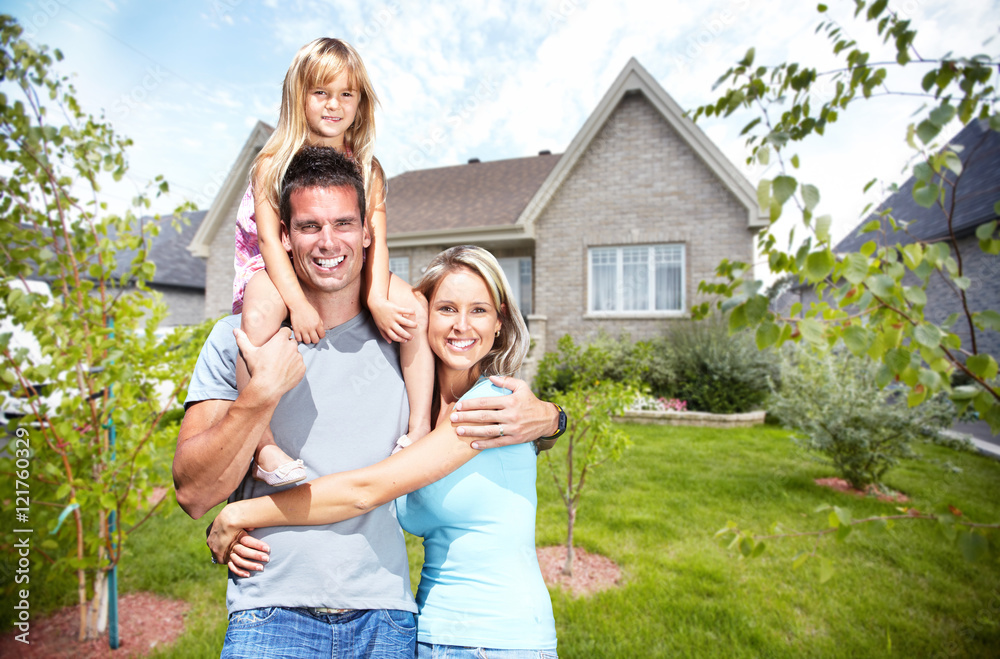 Happy family near new house. Happy family near new house.