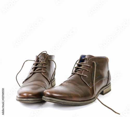lubricated old shoes on a white background