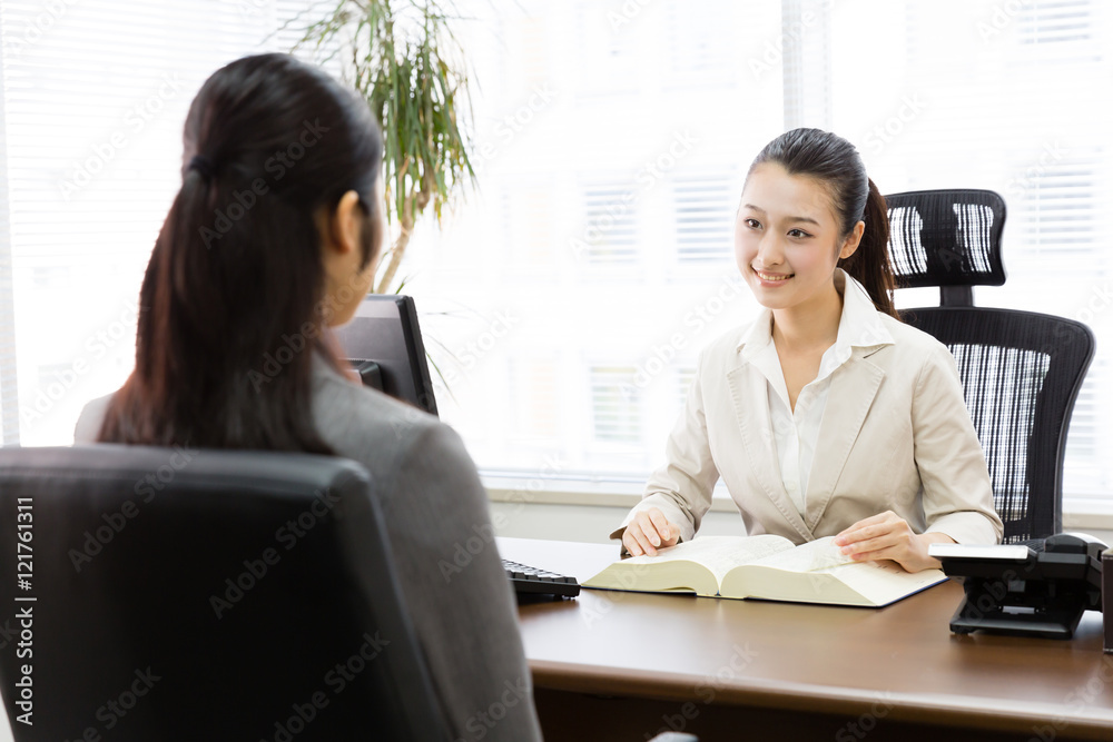 asian businesswomen talking in the modern office asian businesswomen talking in the modern office