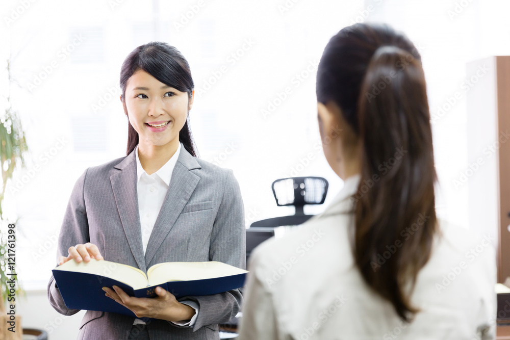asian businesswomen talking in the modern office