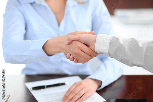 Business people shaking hands, finishing up a meeting