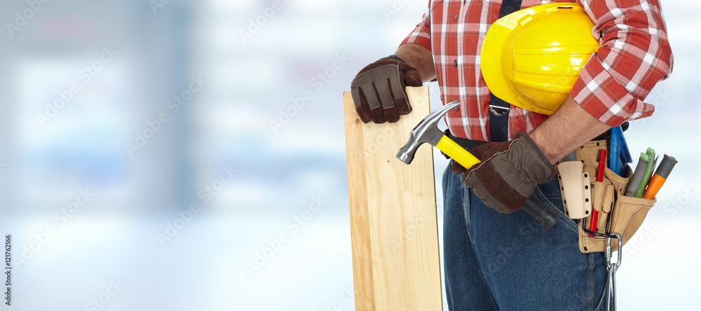 Builder with hammer and wooden planks. Builder with hammer and wooden planks.